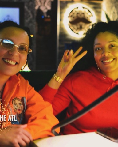 Friends hanging out with hookah, food, and drinks at Moustache Hookah Lounge